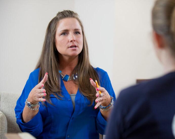 Counselor talking to a patient.