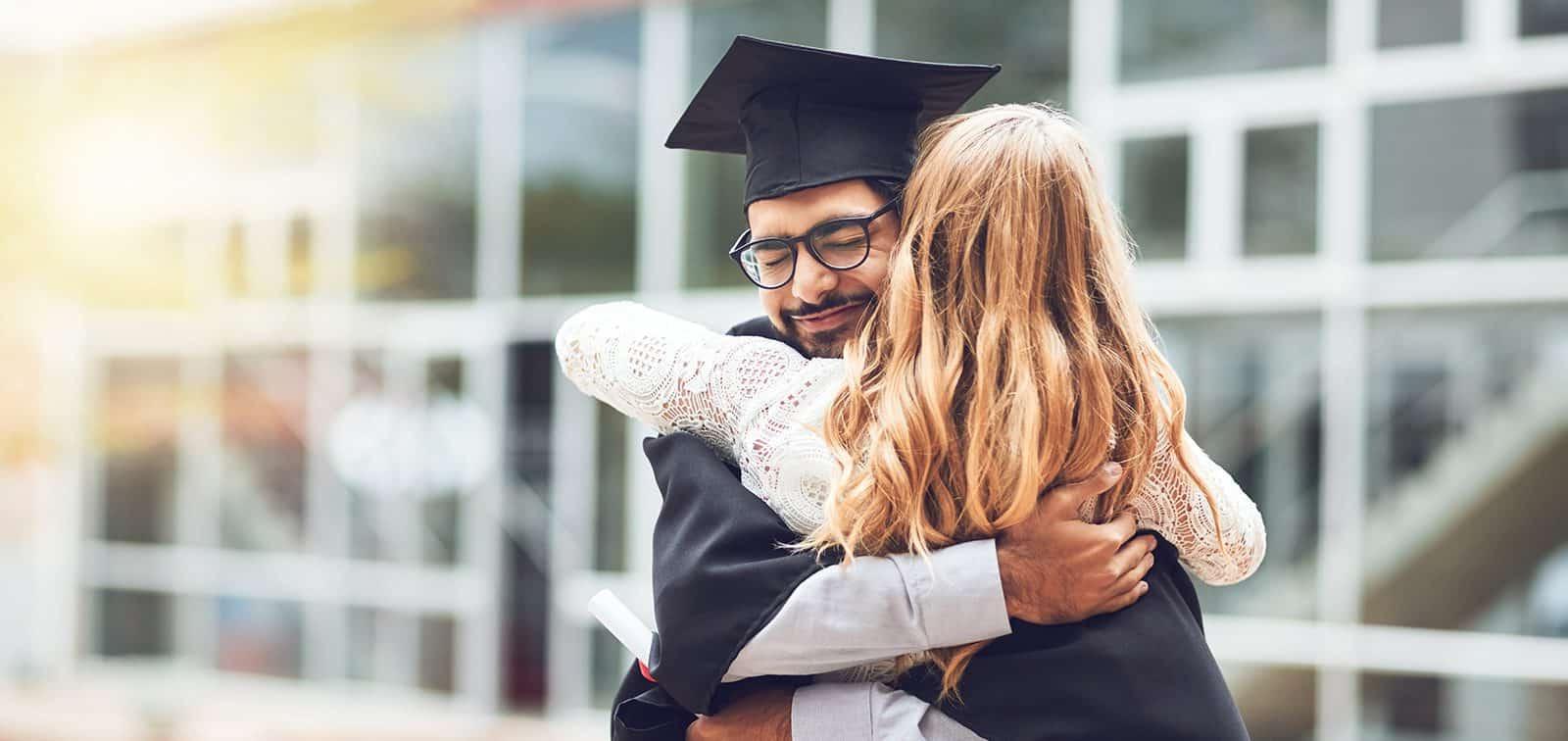 Two people enjoying graduation day