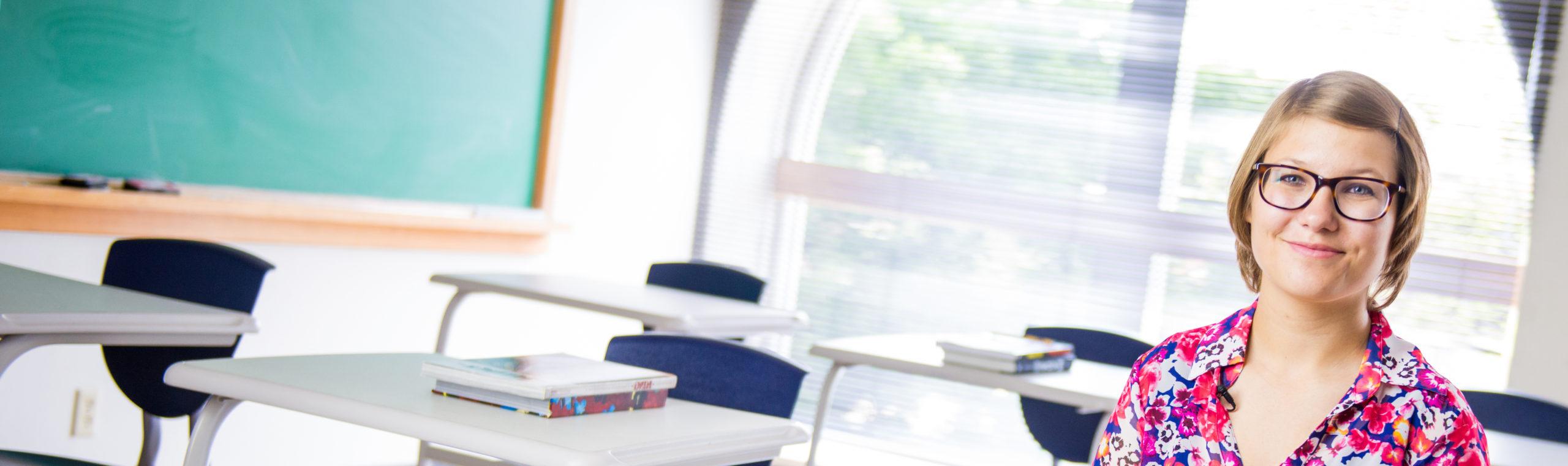 Teacher sitting in a classroom.